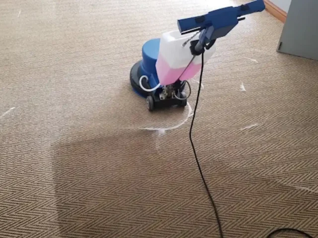 Warm-water extraction cleaning on a fitted carpet (68)