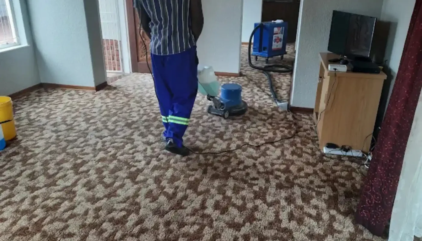 Warm-water extraction cleaning on a fitted carpet (76)