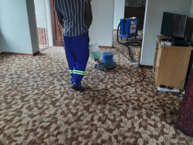 Warm-water extraction cleaning on a fitted carpet (76)